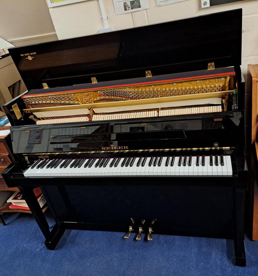 Seiler 116 upright Piano in black – Gallery image – Roberts Pianos Oxford