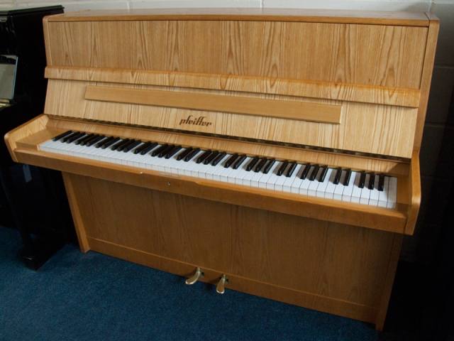 Pfeiffer 112 upright Piano in light crown-cut wood – Inventory thumbnail – Roberts Pianos Oxford