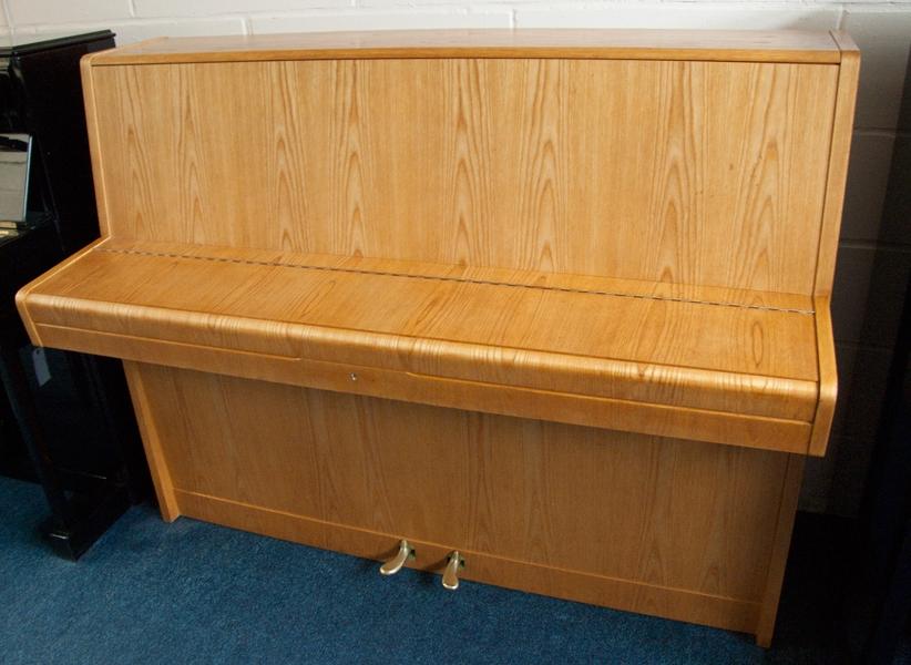 Pfeiffer 112 upright Piano in light crown-cut wood – Gallery image – Roberts Pianos Oxford