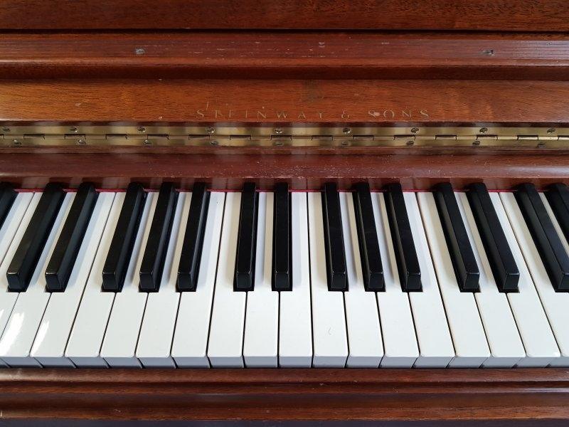 Steinway upright Piano in light satin walnut – Gallery image – Roberts Pianos Oxford
