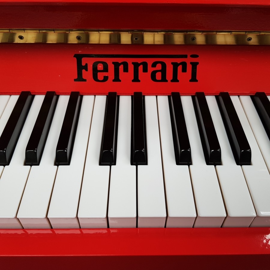 Ferrari Red 107cm upright Piano in Ferrari red – Gallery image – Roberts Pianos Oxford