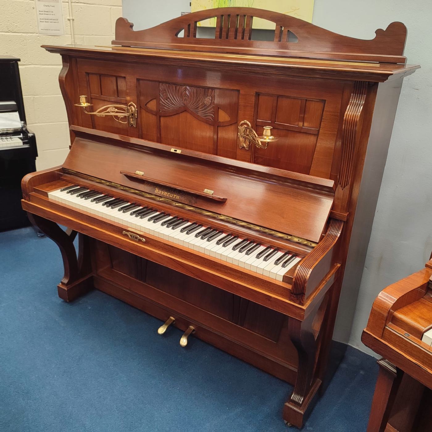 Steingraeber & Sohne upright Piano in walnut – Featured image – Roberts Pianos Oxford