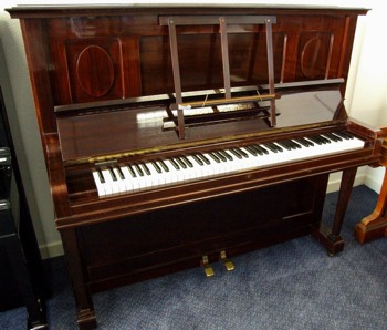 Grotrian Steinweg upright piano in mahogany.
