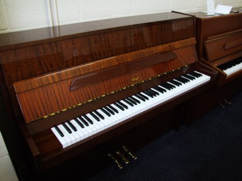Ibach upright piano in mahogany showing keys
